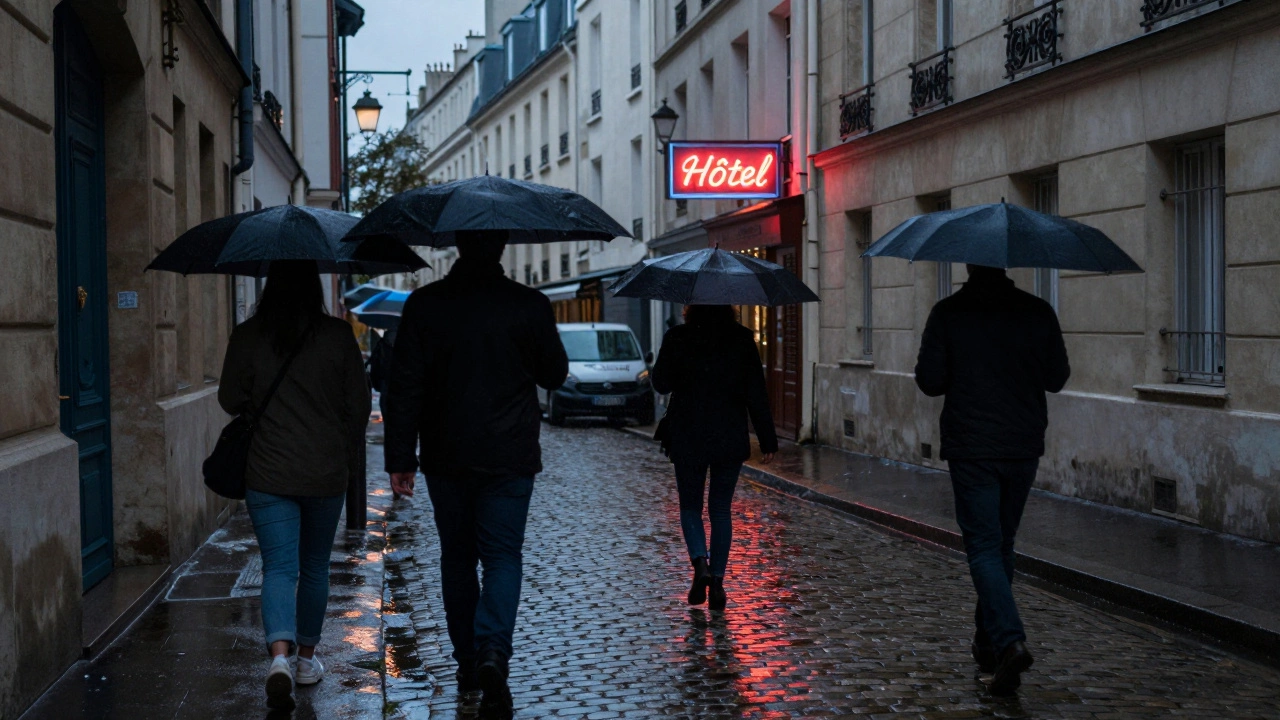 A rainy Paris alleyway at twilight with blurred pedestrians and a faint hotel neon sign.